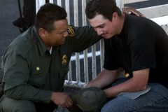 7/30/04- Omar Bernal (CQ) is comforted by a Border Patrol agent while Bernal's wife is worked on by rescue workers.The couple was abandoned in the desert outside of Deming, New Mexico, by their smuggler. She was treated for heat exhaustion and dehydration.  (Pat Shannahan/ The Arizona Republic)