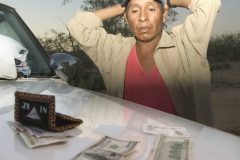 5/6/04- Victoriano Jimenez Ramirez, 30, of Sonora, Mexico, stands next to a  Tohono O'odham Police Department jeep with his  hands up after being caught outside of Sells for crossing the border illegally. He said he was traveling with four other undocumented immigrants who fled into the desert. (Pat Shannahan/ The Arizona Republic)