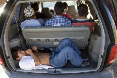 6/3/08- An illigal immigrant lays in the back of a minivan loaded with nine people that was stopped along  I-17.  The group was taken into custody by Maricopa County Sheriff's deputies. (Pat Shannahan/ The Arizona Republic)