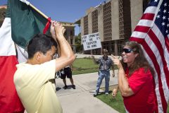 062112711mjp  PNI0626-met politics sb1070 ruling -- 6/25/12-- Anti-SB1070 activist Andy Hernandez argues with SB1070 supporter Allison Culver (CQ) outside the Arizona State Capitol after Supreme Court ruled on Arizona's immigration law. Pat Shannahan/The Arizona Republic