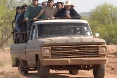 4/17/04 Border crossers ride in the back of a pick-up truck as they head from Sasabe, Mexico, to the border. Arrests are up more than 90 percent from last year along Arizona's border with Mexico. In March and April, the average number of daily arrests topped 2,000. (Pat Shannahan/ The Arizona Republic)